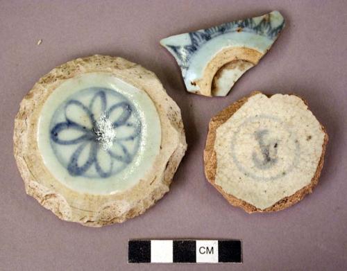 Blue and white potsherds - floral decoration; one hole-bottom sherd