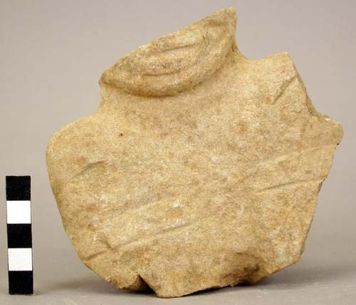 Fragment of stone figurine