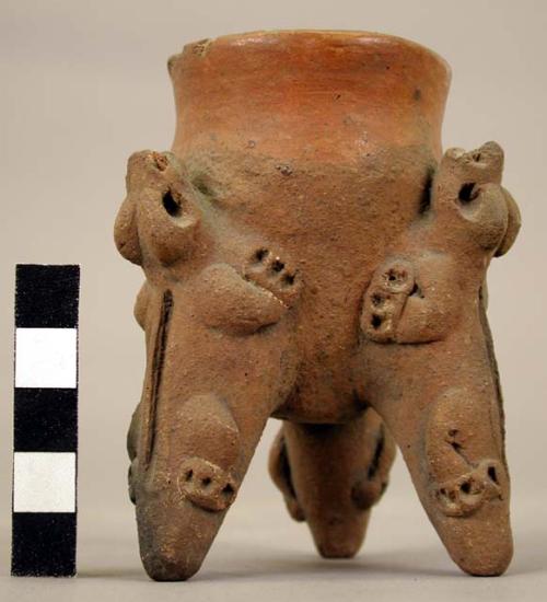 Small pottery tripod vessel with effigy feet