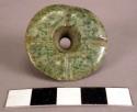 Jadeite bead.  Truncated cone shape.  4 incised lines on one surface.  1 1/4"w