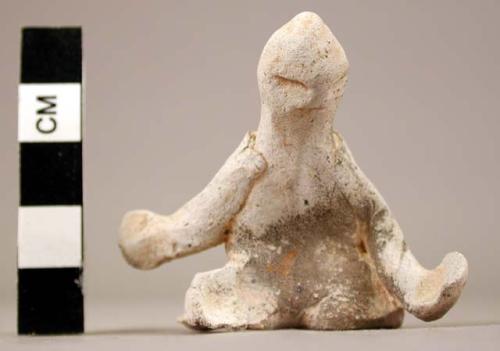 Small, crude clay figurine- human