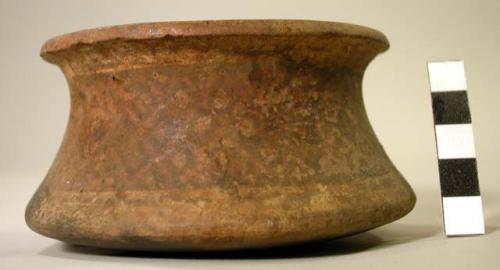 Ceramic jar,  flaring rim, black on brown decoration, highly exfoliating, mended