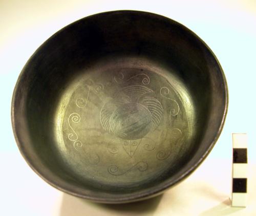 Black bowl with black designs