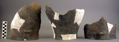 Ceramic jar sherds, large, black, mended, reconstructed