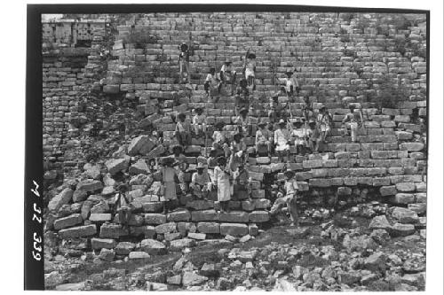 Group of workmen at main stairway at Monjas