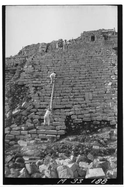 Raising timber for repair work at the stairs of Monjas