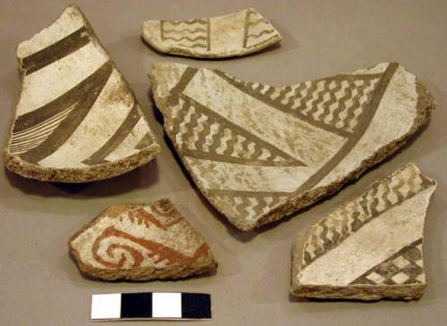 Ceramic rim and body sherds, red on white, black on white, geometric designs