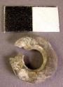Stone, ground stone, bead or ring, round with central perforation