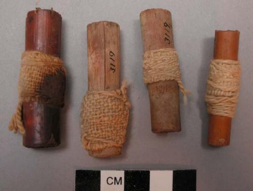 Wood, cane cigarettes, wrapped in cotton fabic and knotted twine