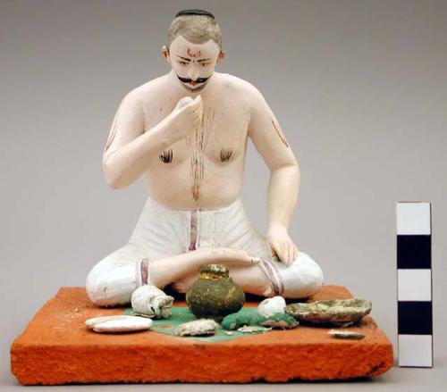 Figurine, seated male, Hindu dining