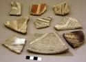 Ceramic rim and body sherds, black on white, red on white, geometric