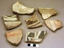 Ceramic rim and body sherds, black on white, red on white, geometric design