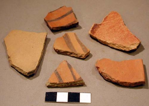 "intrusive" red potsherds