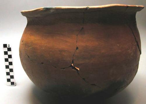Pottery cooking pot, reddish brown, large, incised decoration on outcurving rim