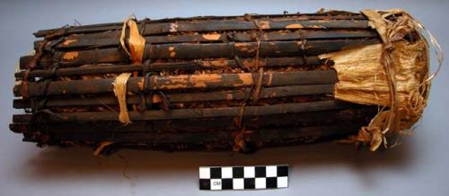 Tobacco leaves in plastered basketry container. Tumba in Mtagara