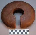 Unclassified wood object, rounded C-shape, metal inlay, perfs. near slot