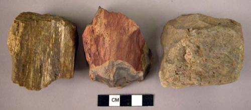 3 small hand adzes or scrapers of fossil wood