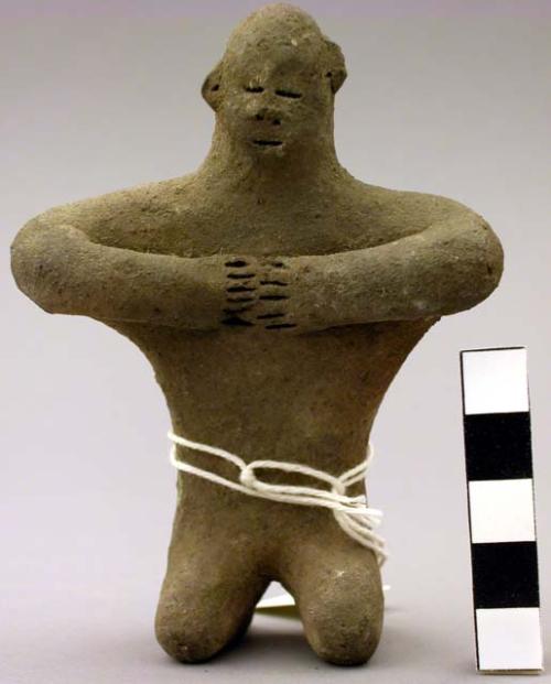 Clay figure, kneeling