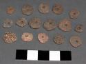 16 small perforated stone objects - beads?