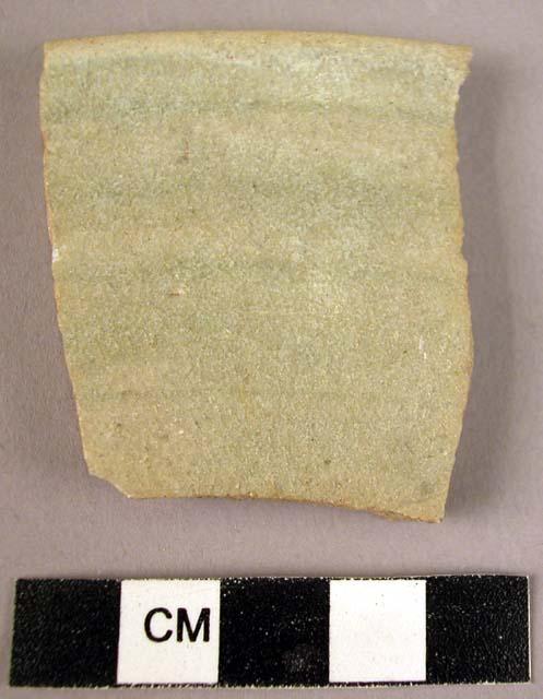 Pottery rim sherd - brown-green glaze