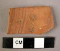 Potsherd - red-brown, incised, stamped?