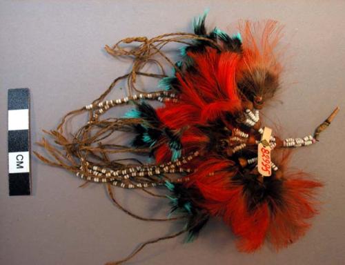 Feather, bead and seed lip ornament