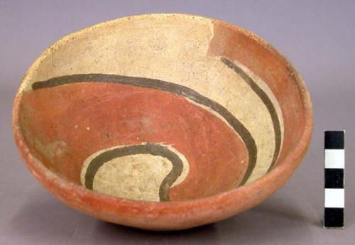 Pottery bowl with brown, red and white designs