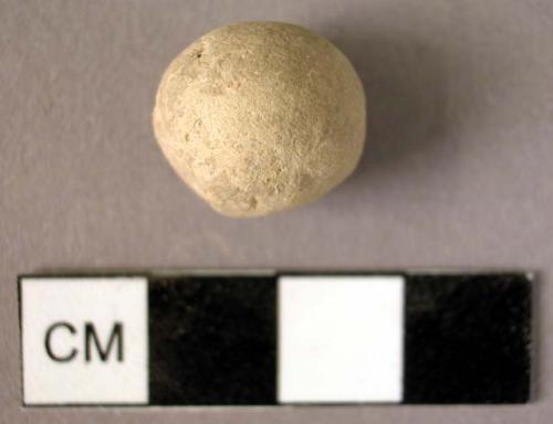 Ceramic sherd, spherical, tan, unfinished bead?