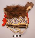 Skin pouch--trimmed with elk fur; fringed with red flannel with loop handle