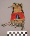 Small leather pouch beaded and fringed with metal ornaments on fringe