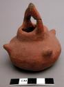 Small red pottery vessel - with handle