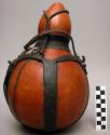 Gourd container with gourd stopper, leather carrying strap, mended with sewn gra
