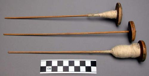 Spindles, with gourd collars (3 examples); "tchali buge", less expensive, but mo