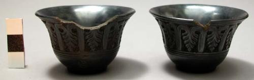 2 broken miniature black pottery cups with incised lotus (?) pattern