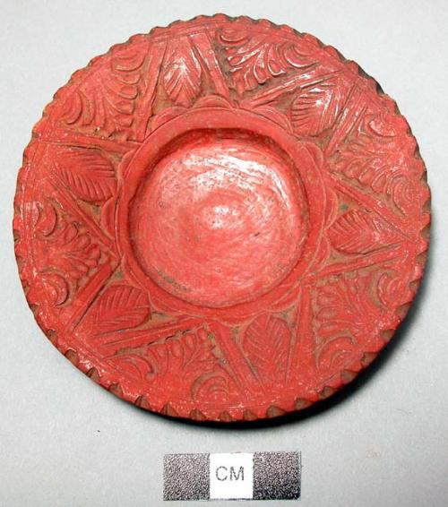 Miniature red pottery plate with incised leaf design