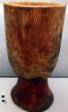 Carved wooden bowl, cylindrical, w/ flared pedestal base, from 1 piece of wood.