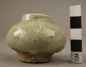 Ceramic miniature, jar, lt. green glaze, globular body, ring base, straight rim