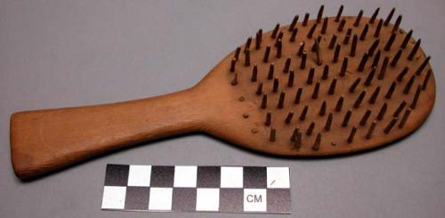 Wooden hair brush of old woman's hair