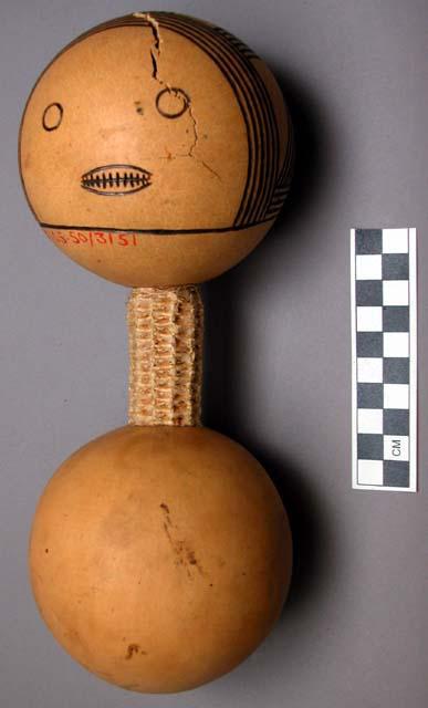 Doll made from 2 monkey oranges joined by a corn cob - used by the children