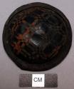 Leather ornament (button?), dome w/ flat base, checkered cut design, worn