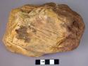 Massive single-ended hand adze of fossil wood