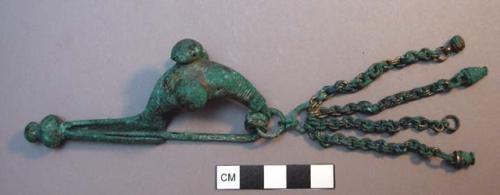Fibula with chain and pendant attached