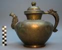 Yellow brass tea pot with white brass trimmings; short spout +