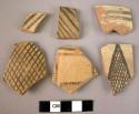 8 rim potsherds - painted on light (B3)