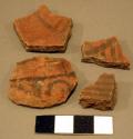 Black-on-red and red potsherds