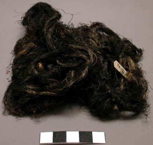 Bundle of coarse, black dyed cord