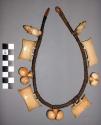 Necklace covered with carved ivory pendants