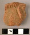 Rim potsherd - red-brown, relief and incised