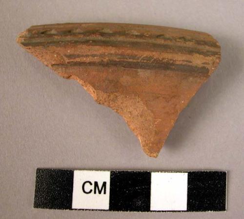 Rim potsherd - red painted and relief (A3)