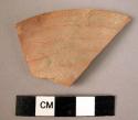 Rim potsherd - light brown, incised